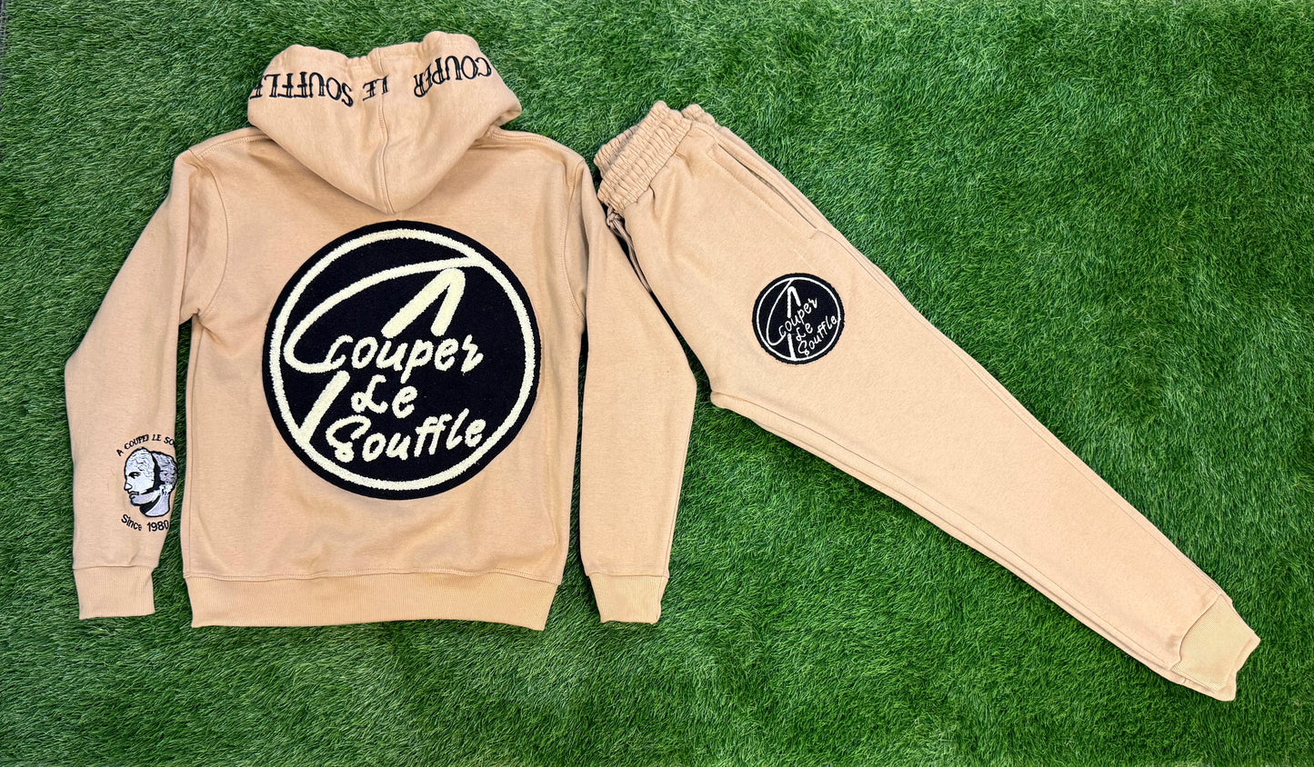 A Couper Le Souffle Unisex Tan SweatSuit Logo